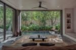 Co-Lab Design residence interior at La Reserva Tulum with natural stone floors and hardwood carpentry.