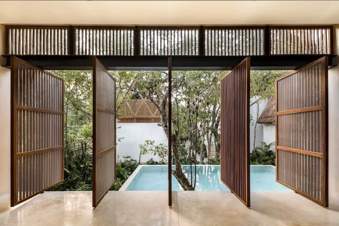 jungle-keva-tulum-yoga-pavilion.webp Cantilevered yoga pavilion over the pool at Jungle Keva, designed by Jaque Studio, Tulum