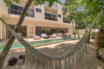 Ground-floor lap pool and private garden at Villa Xatá in Aldea Zama, Tulum