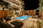 Marble-striped infinity common pool between the two buildings at Majaró boutique hotel in La Veleta Tulum