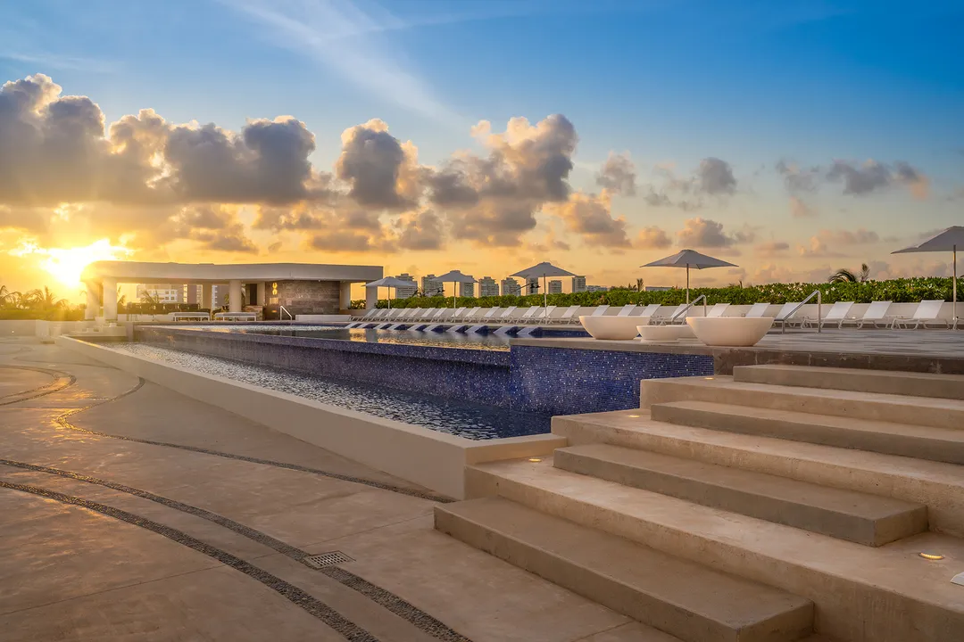 blume-puerto-cancun-infinity-pool.webp Infinity pool overlooking the marina at Blume Puerto Cancun