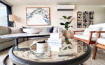 AWA Playacar penthouse open-plan living and dining area with palm tree views