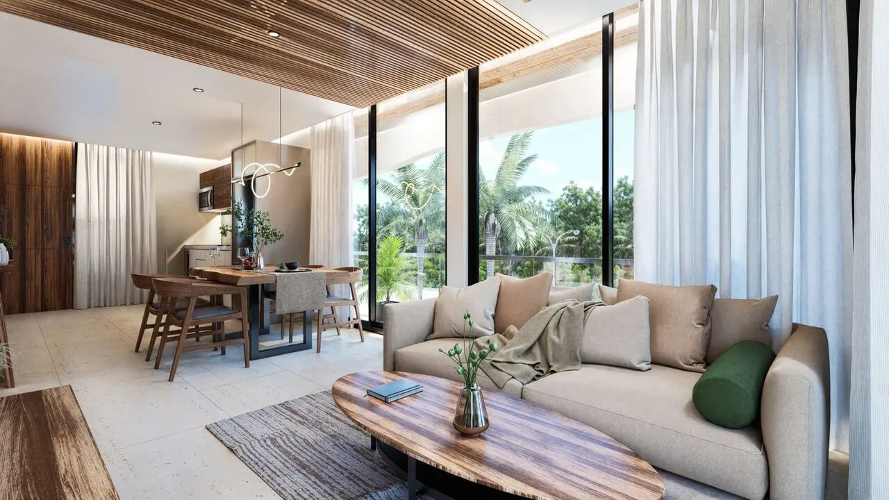 Two-bedroom condo interior at DK42 Playa del Carmen showing living area and balcony
