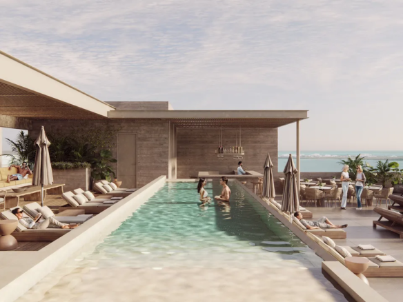 Rooftop pool and sun deck at Lumia Cancún