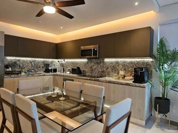 Furnished open-plan living area at PortoBlu near the beach