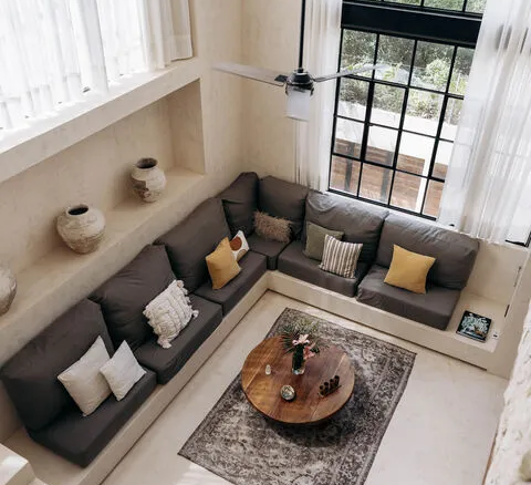 Double-height living space of the Region 15 Tulum penthouse