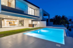 Double-height living room and pool at the Lagos del Sol villa