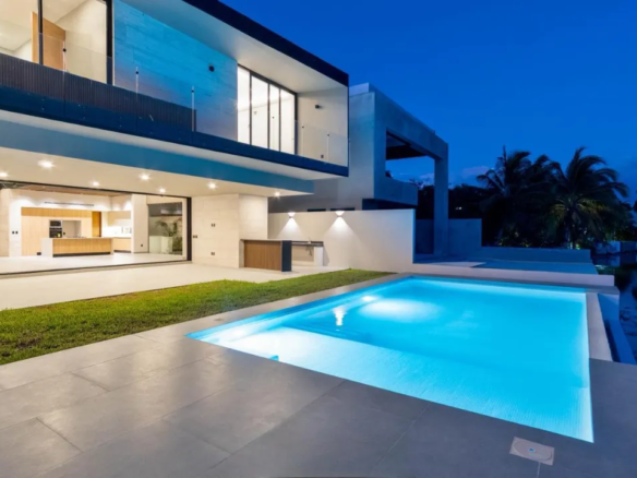 Double-height living room and pool at the Lagos del Sol villa