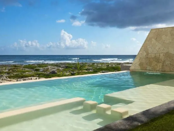 Infinity pool facing the beach at Casa Alina Tankah Bay