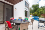 Heated pool and outdoor dining at Casa Bahamas Tulum