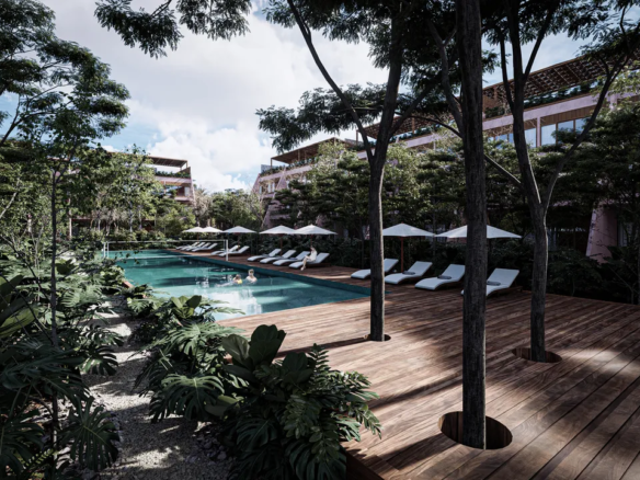 Semi-olympic pool and jungle gardens at Kiino Cozumel