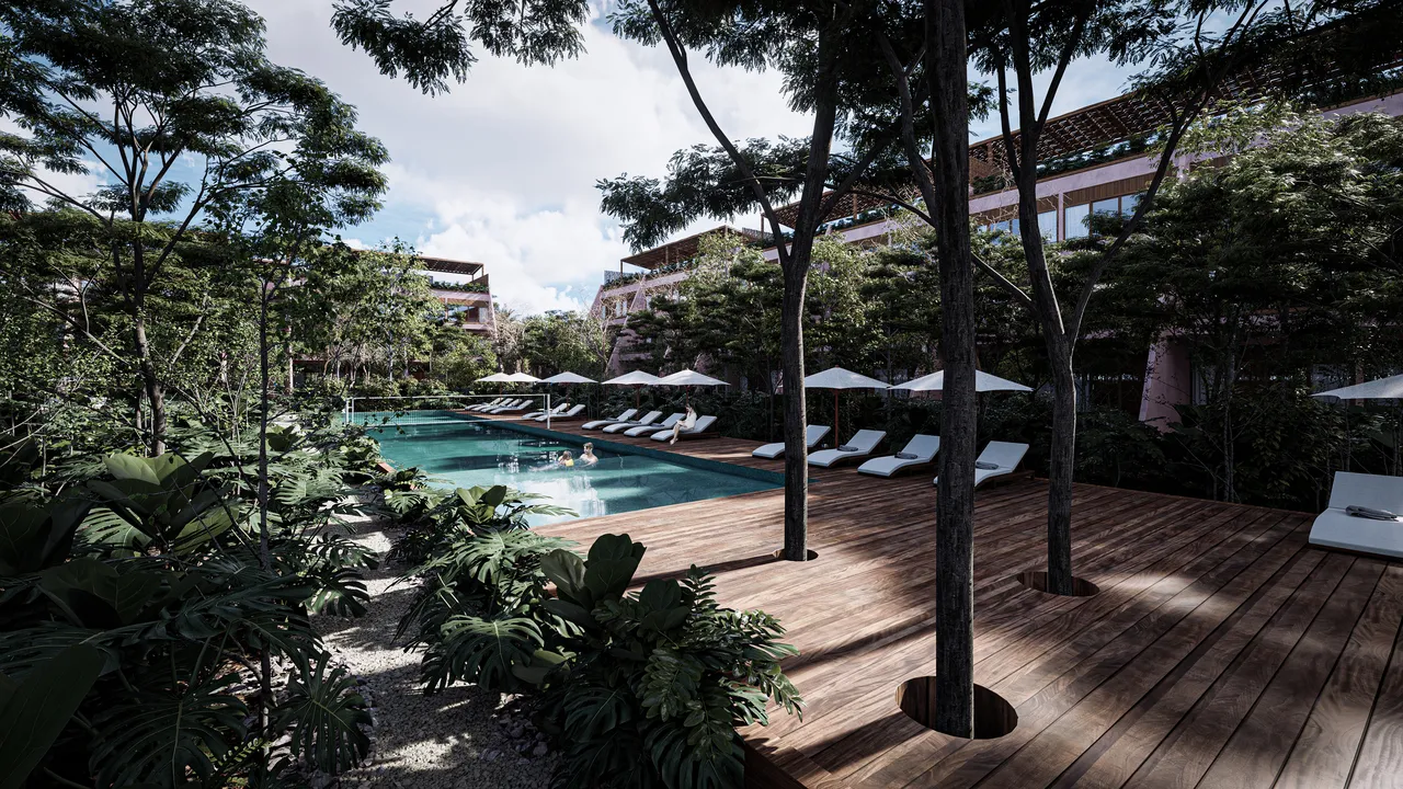 Semi-olympic pool and jungle gardens at Kiino Cozumel