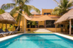 Garden pool and palapa at the Caleta Tankah property