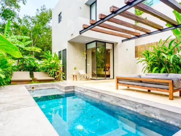 Private pool and tropical garden at Villa 6 Aldea Zama