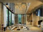 Open social area with floor-to-ceiling glass at Visara Aldea Zama