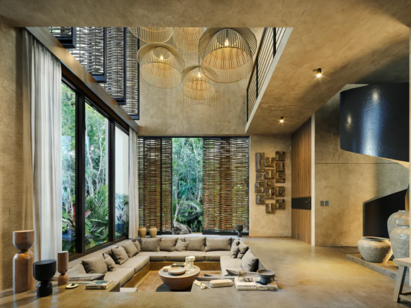 Open social area with floor-to-ceiling glass at Visara Aldea Zama