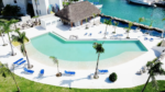 Pool and palapa on the canal at Bloom Puerto Aventuras