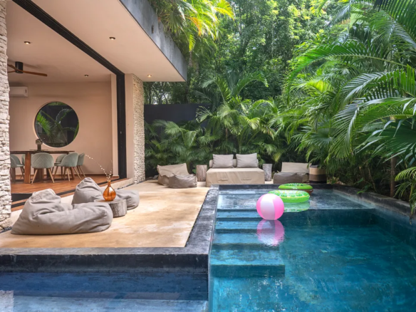 Swim-up pool and sunken living room at Maison Siscolino